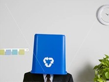man with recycling bin on his head